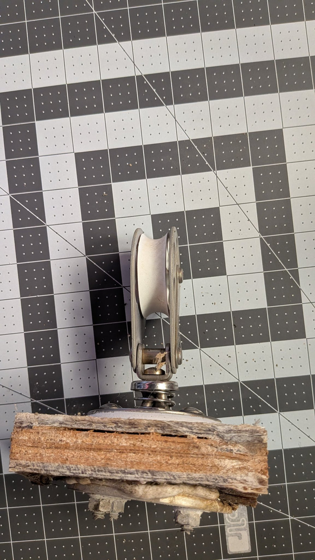 Side view of Schaefer stand-up block sheave on 1-inch grid