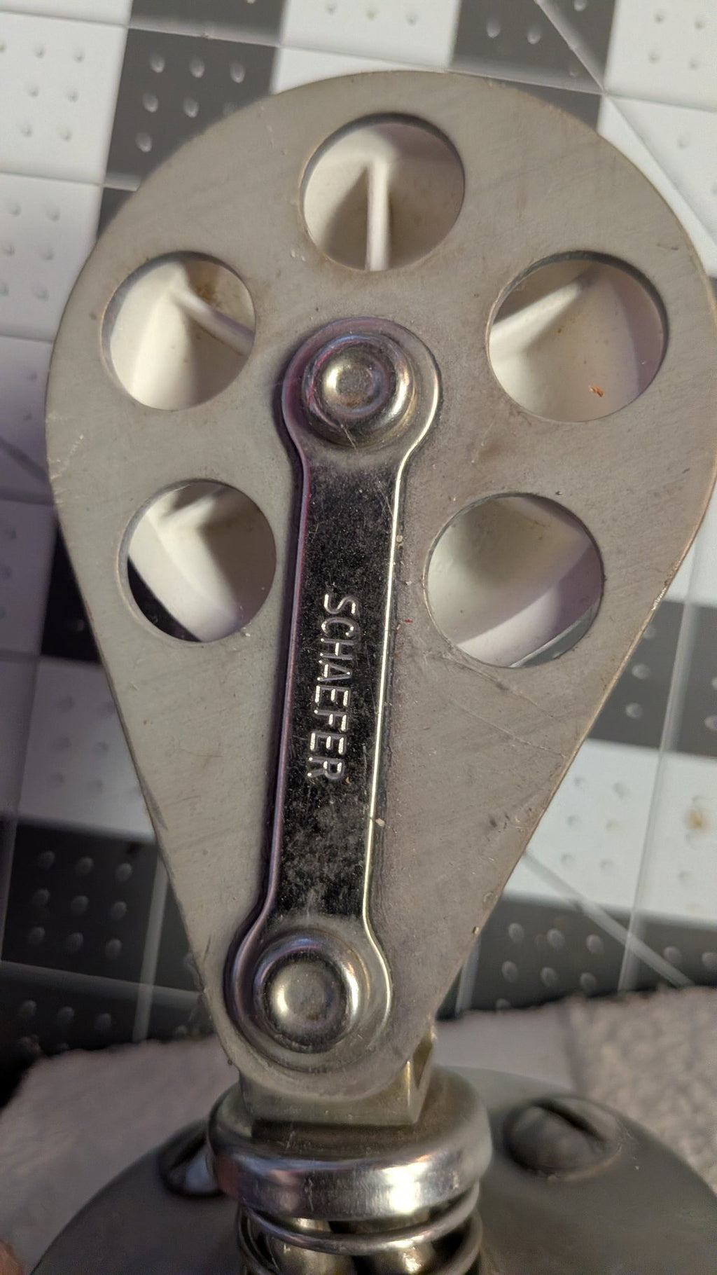 Close-up of SCHAEFER stamp on block strap