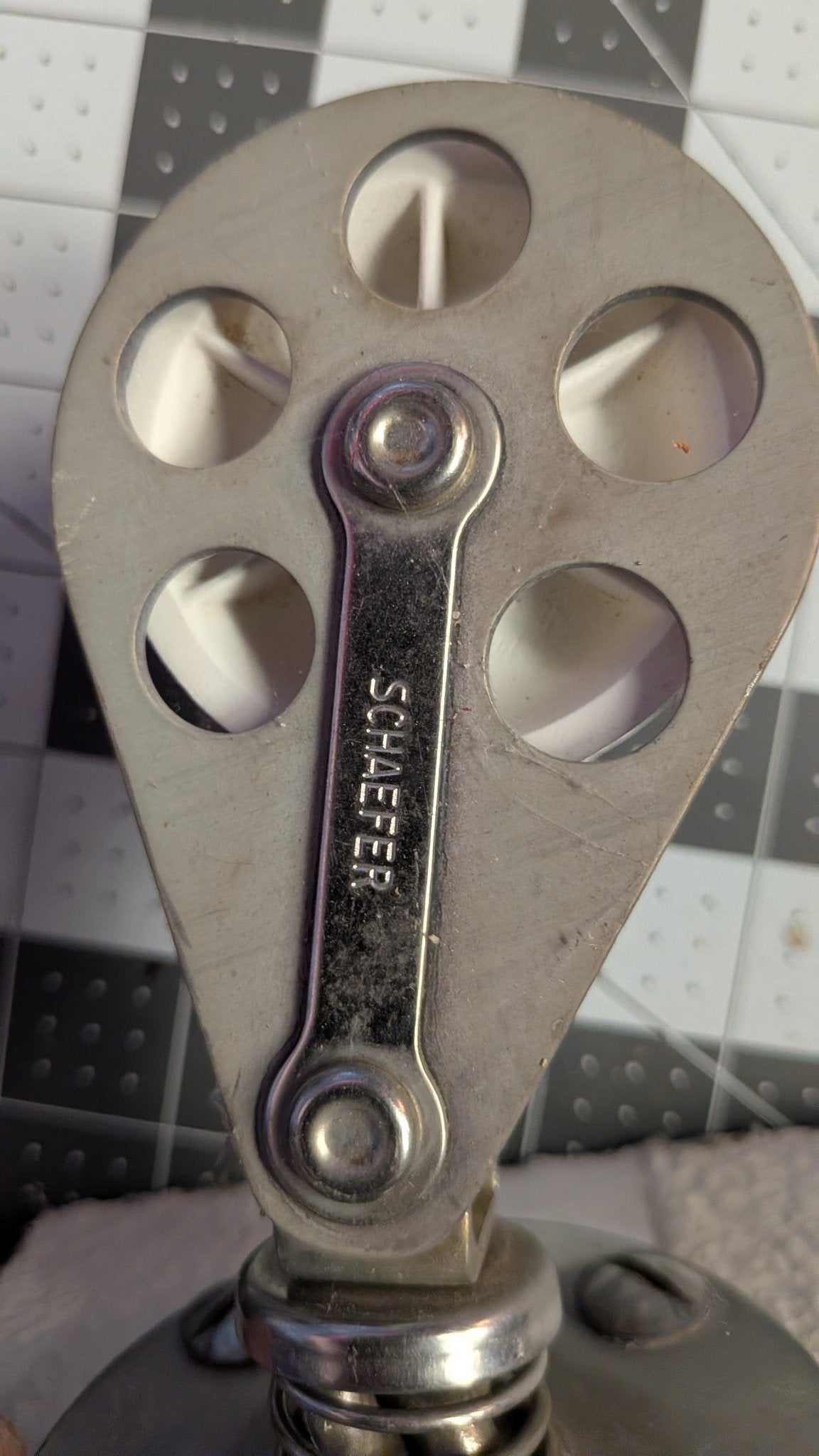 Close-up of SCHAEFER stamp on block strap
