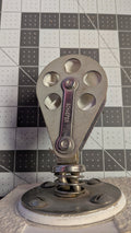 Schaefer 7 Series stand-up swivel block front view on 1-inch grid