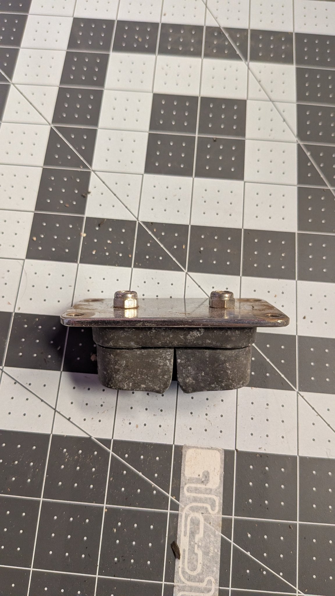 Stainless base plate underside of Harken double cam cleat