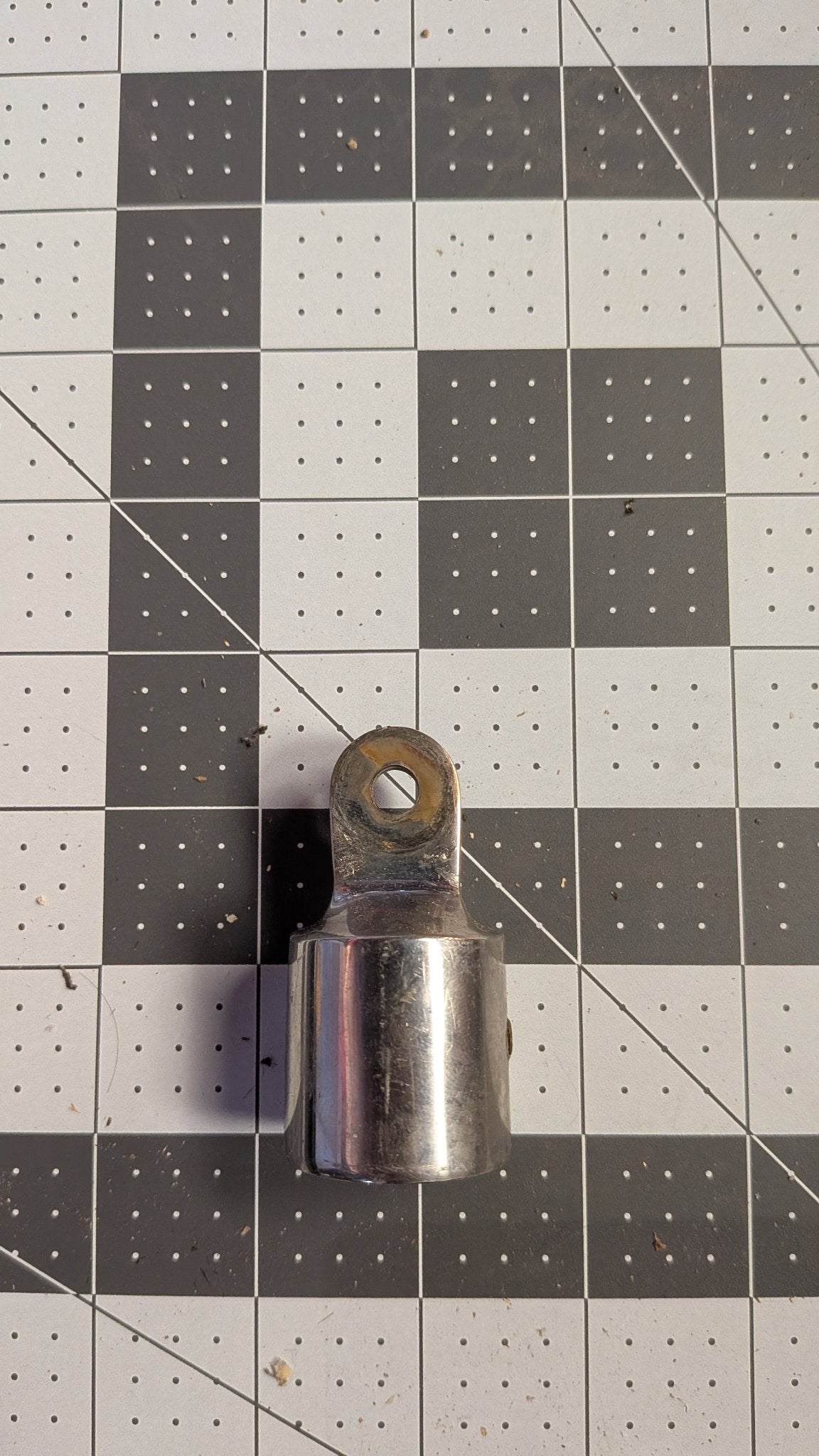 Stainless stanchion top cap with lifeline eye front view on 1-inch grid