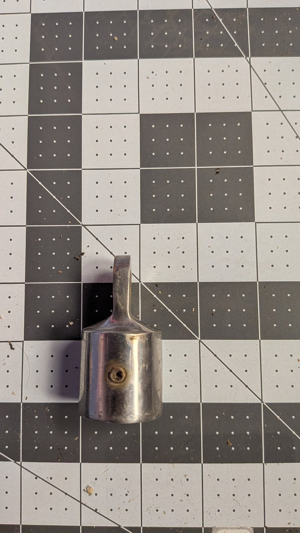 Side view of stanchion top cap showing set screw hole on 1-inch grid