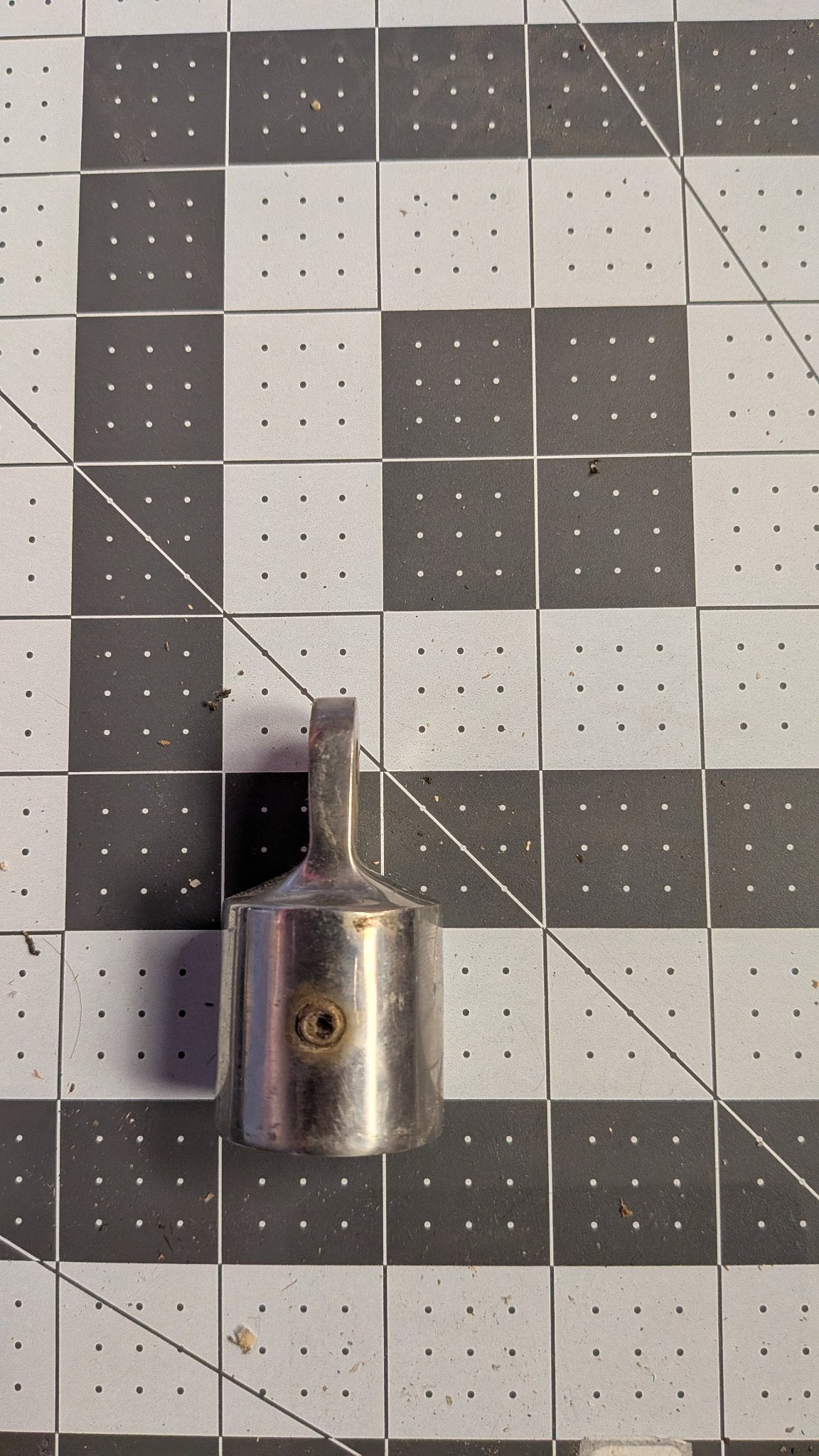 Side view of stanchion top cap showing set screw hole on 1-inch grid