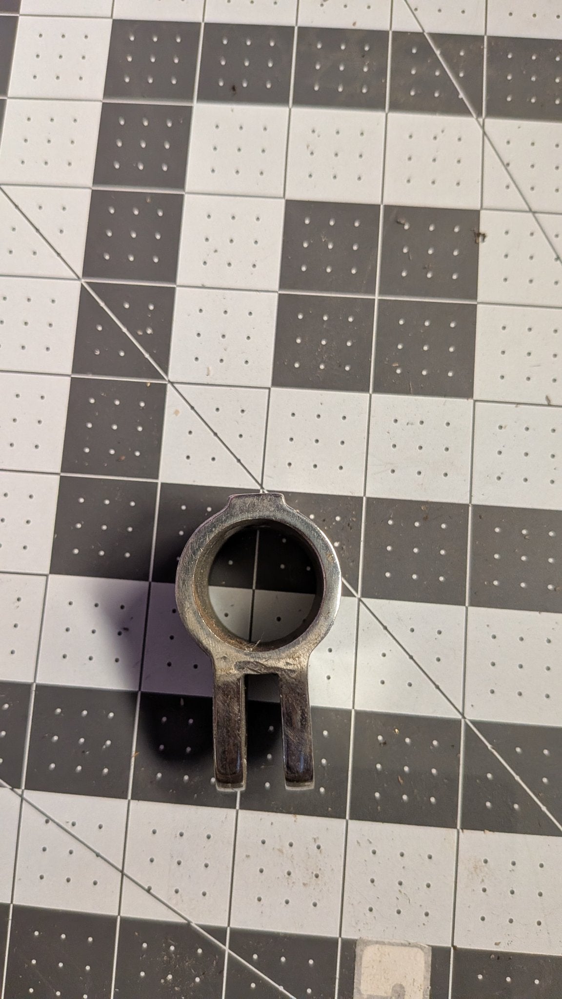 Top view of jaw slide showing clamp opening on 1-inch grid