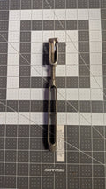 Stainless open-body turnbuckle with toggle jaw front view on 1-inch grid