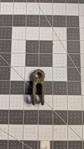 Vintage Merriman bronze rigging toggle front view on 1-inch grid
