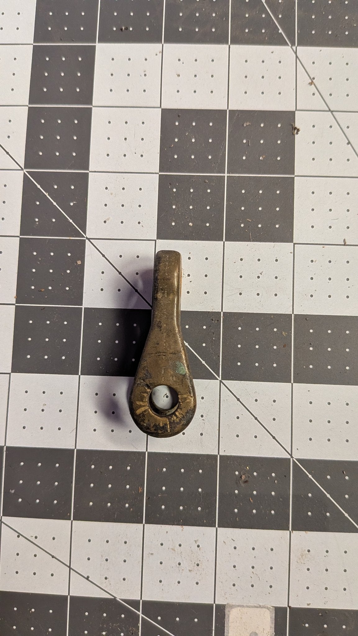 Reverse view of bronze toggle on 1-inch grid