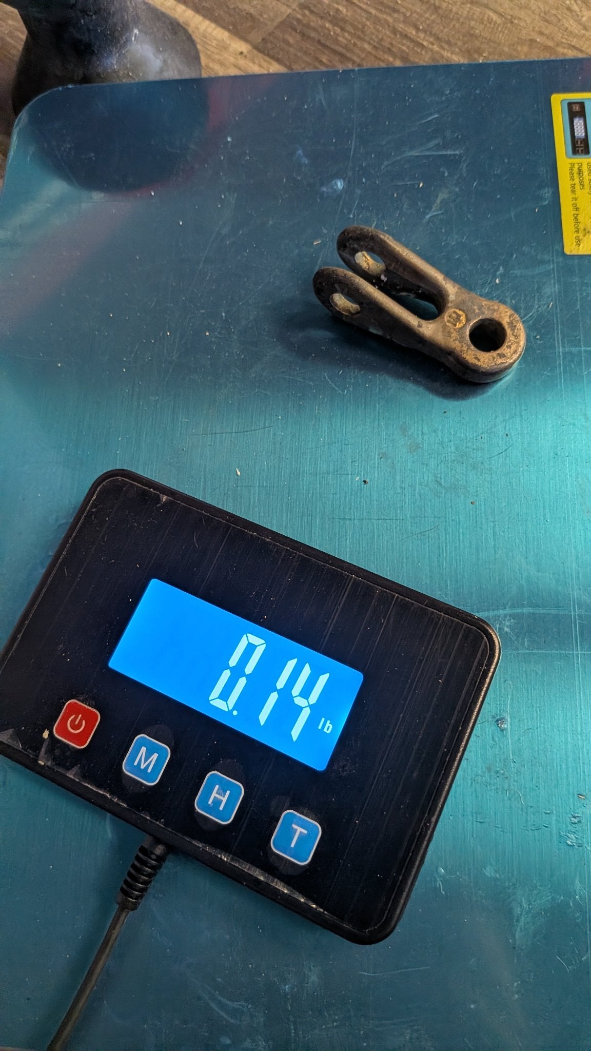 Bronze toggle on scale showing 0.14 lb