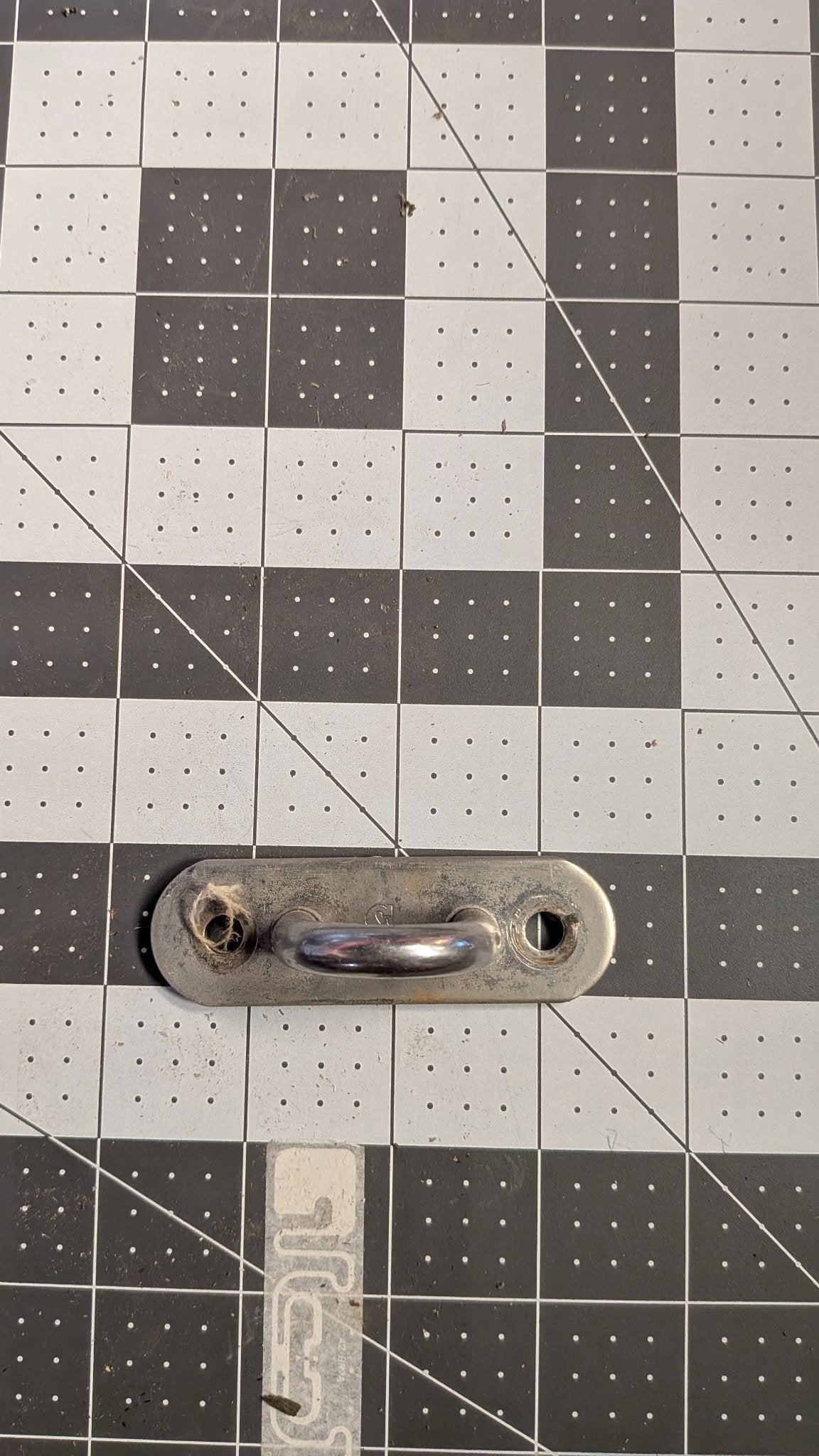 Top view of pad eye base plate with mounting holes on 1-inch grid