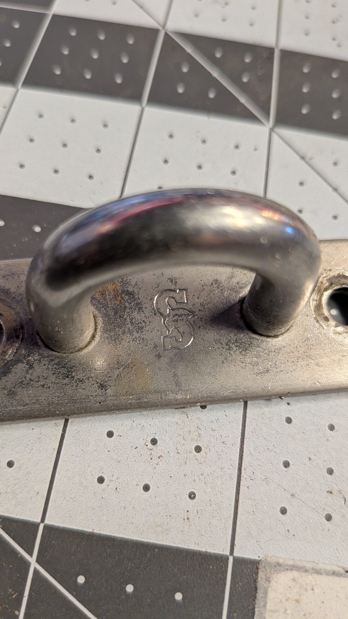 Close-up of CS maker's mark on pad eye base