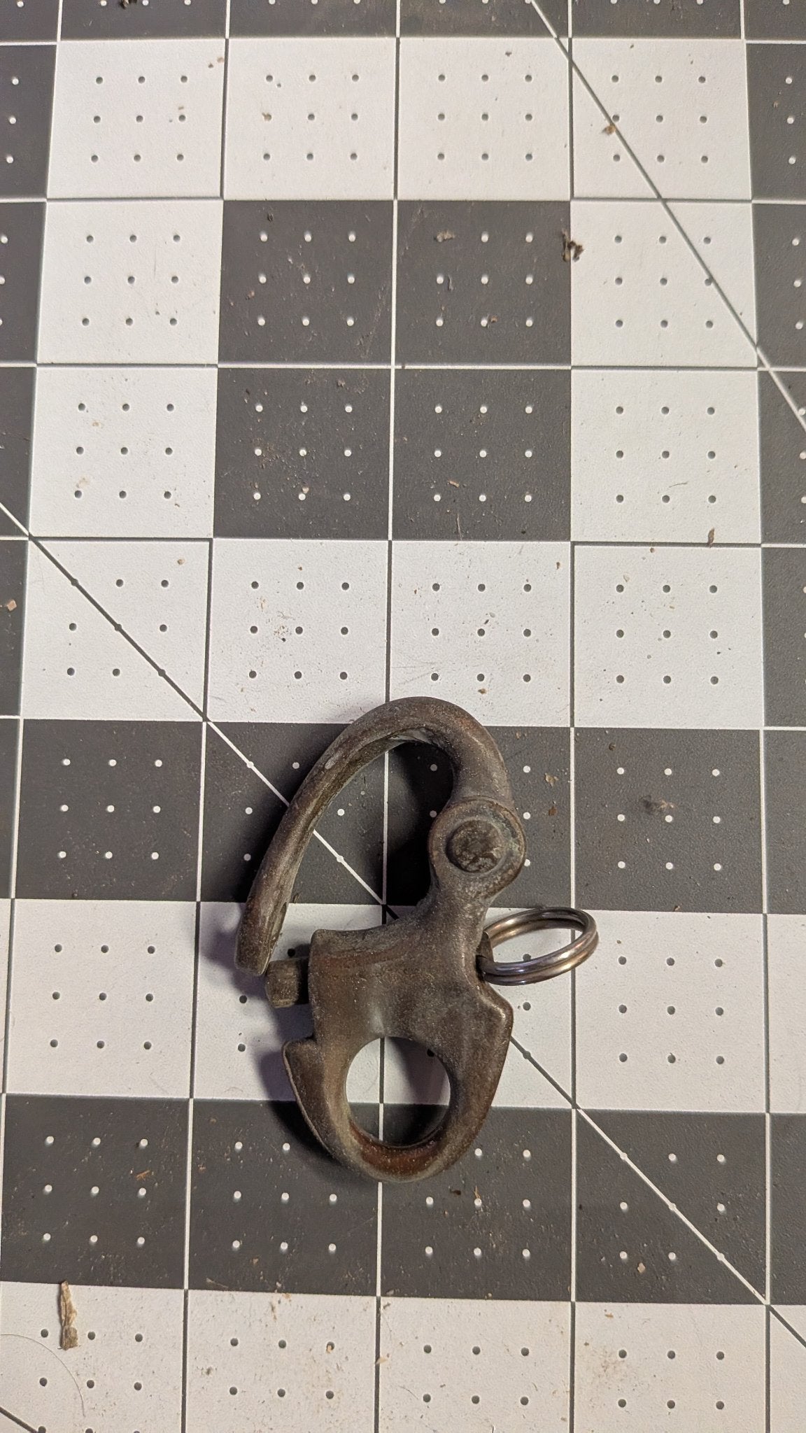 Vintage Swedish bronze snap shackle front view on 1-inch grid