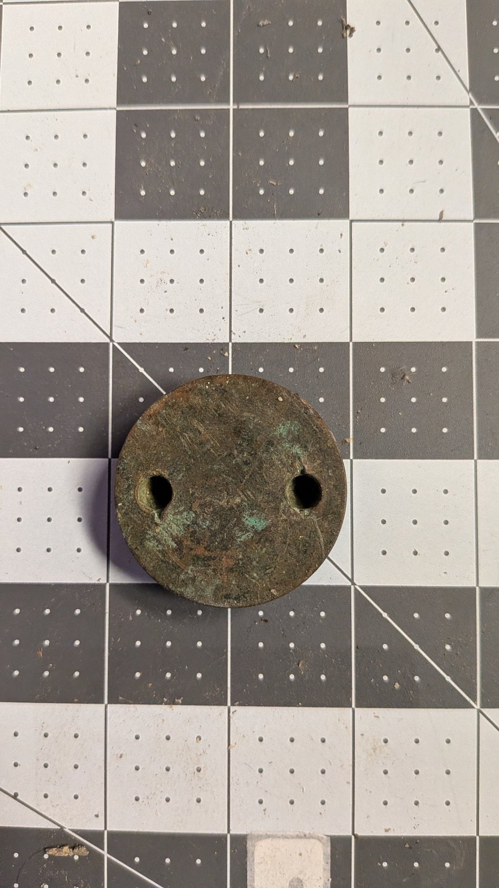 Bronze garboard drain plug top view with spanner holes on 1-inch grid