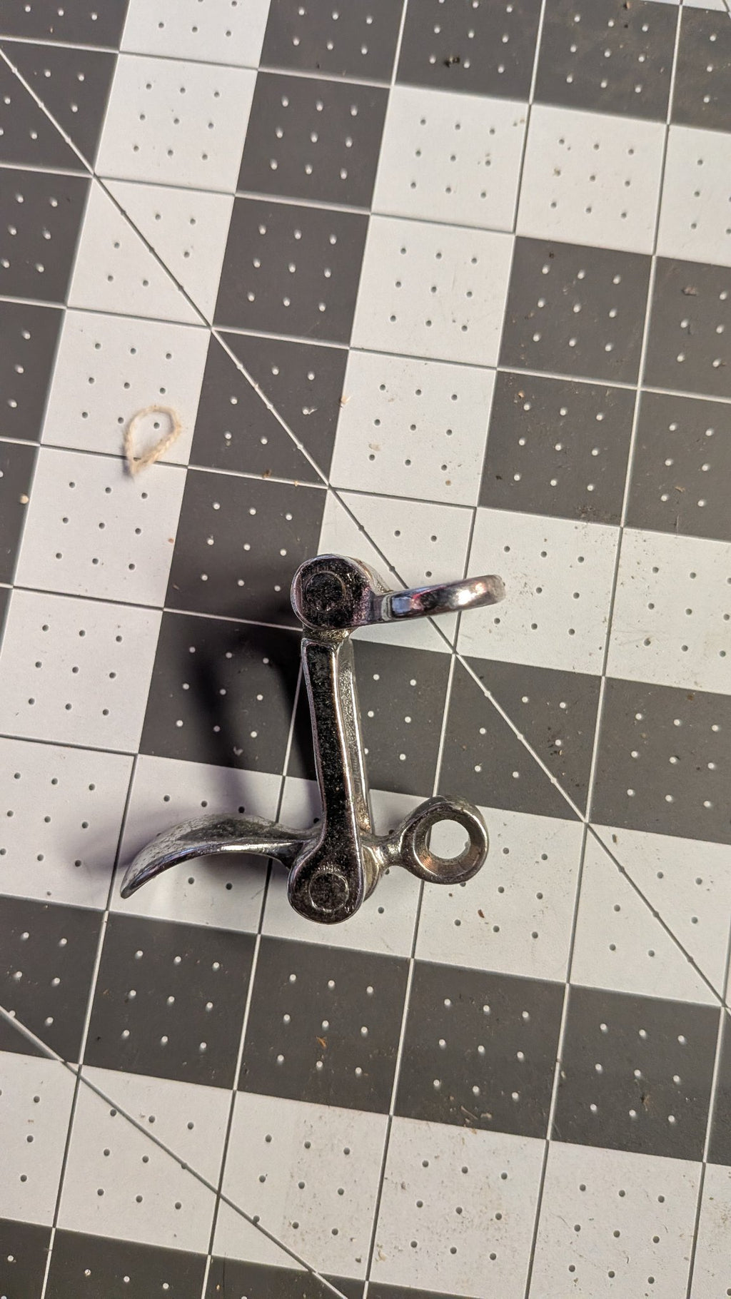 Side view of hatch latch showing folded profile on 1-inch grid