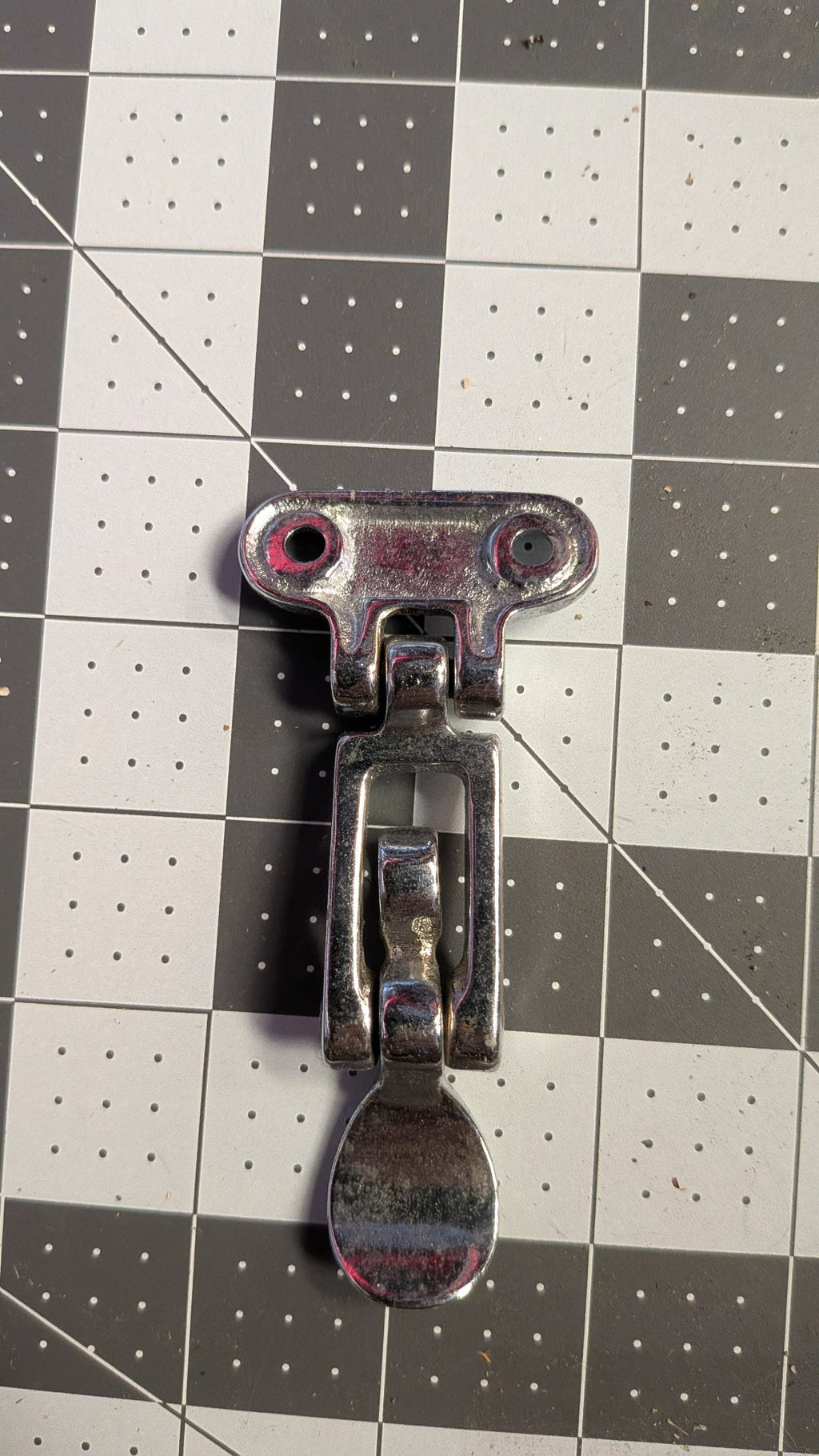 Back view of hatch latch mounting bracket on 1-inch grid