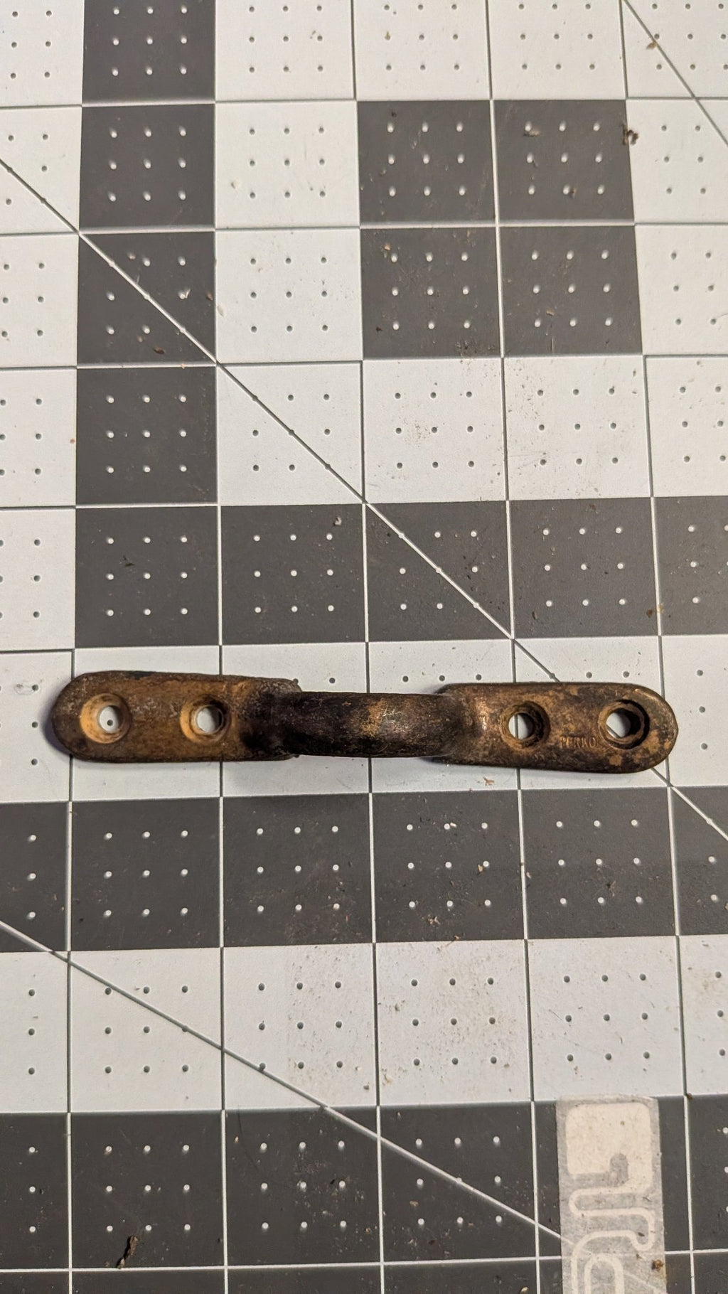 Perko bronze footman loop top view on 1-inch grid