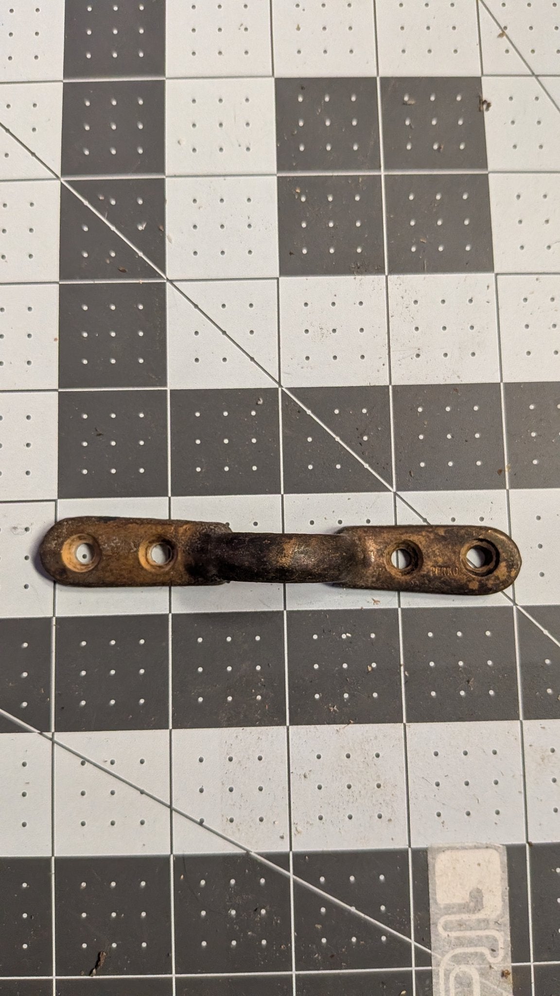 Perko bronze footman loop top view on 1-inch grid