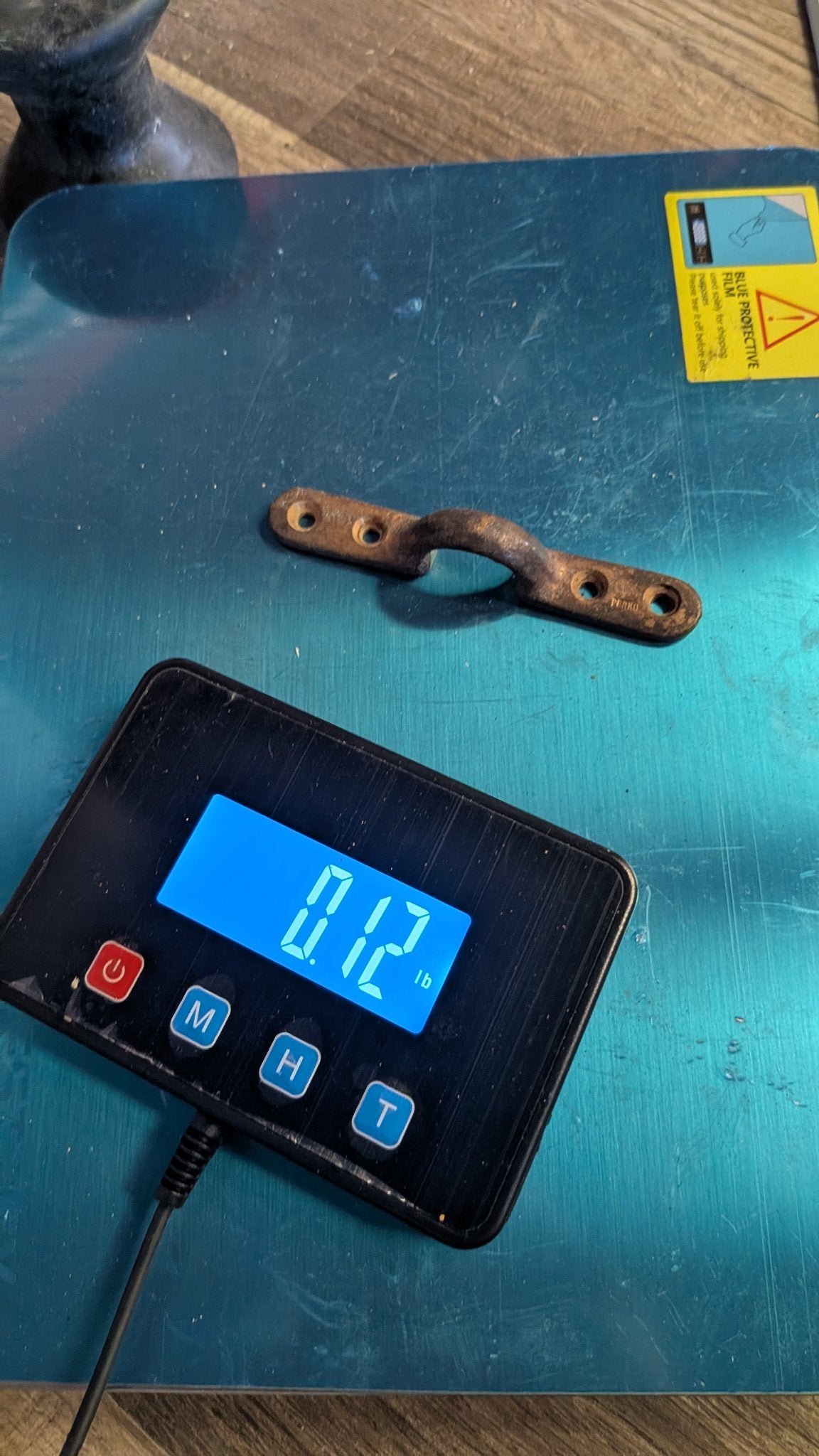 Perko bronze footman loop on scale showing 0.12 lb