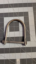 Stainless U-bolt bow eye with nuts front view on 1-inch grid