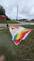 Hood Sails symmetric spinnaker laid out — rainbow panels on white, 26 ft 7 in luff