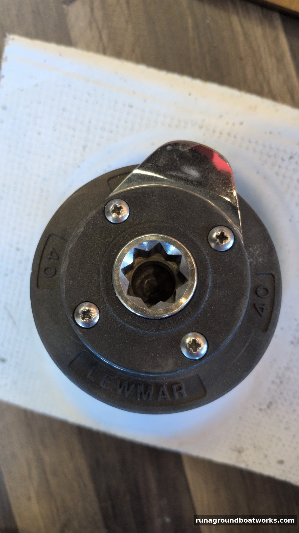 Lewmar 40 self-tailing winch, top view, LEWMAR and 40 cast into the top, stainless feeder arm
