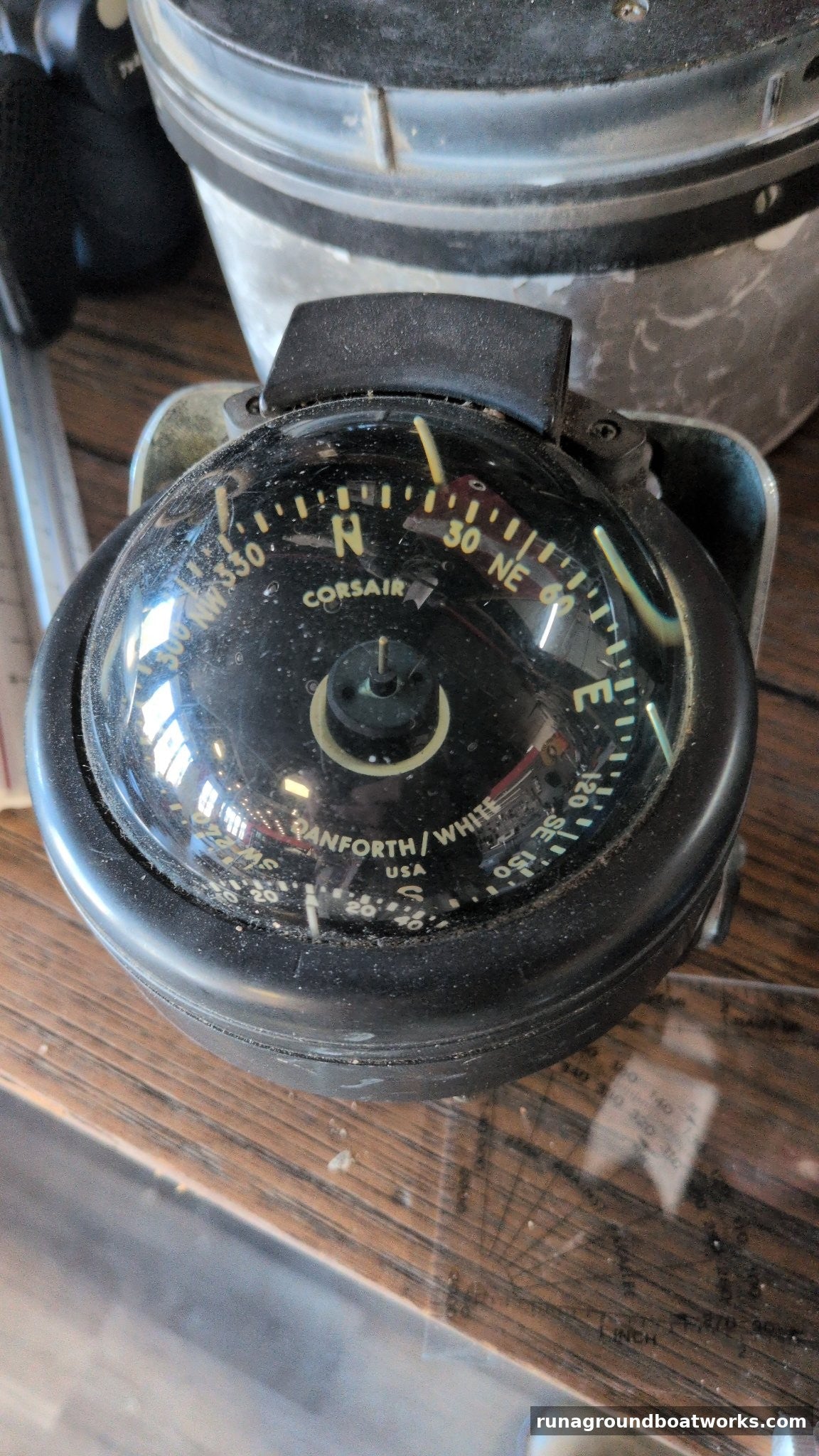 Danforth White Corsair marine compass, front, black card with degree and cardinal markings