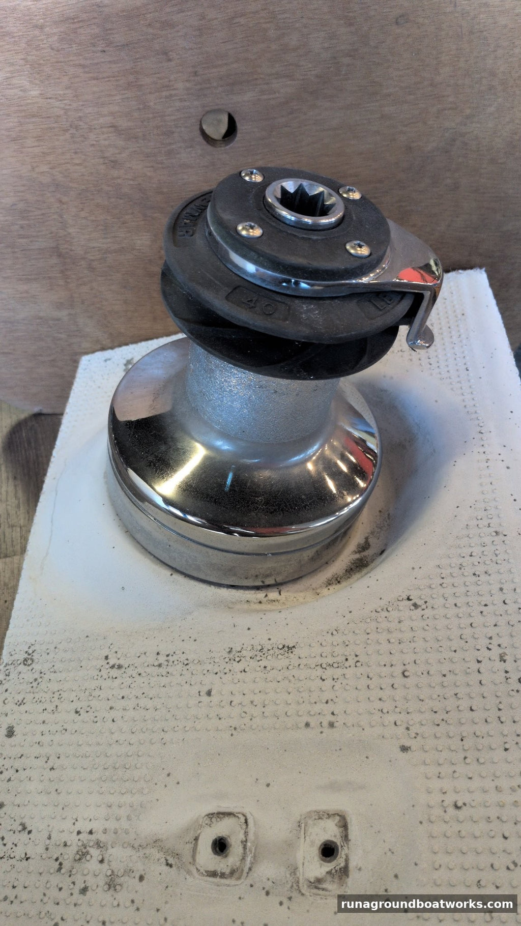 Lewmar 40 self-tailing winch, side view, self-tailing jaws, feeder arm and chromed base