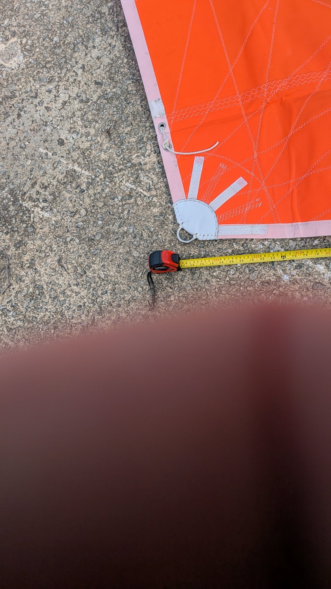 Clew corner with tape measure for scale