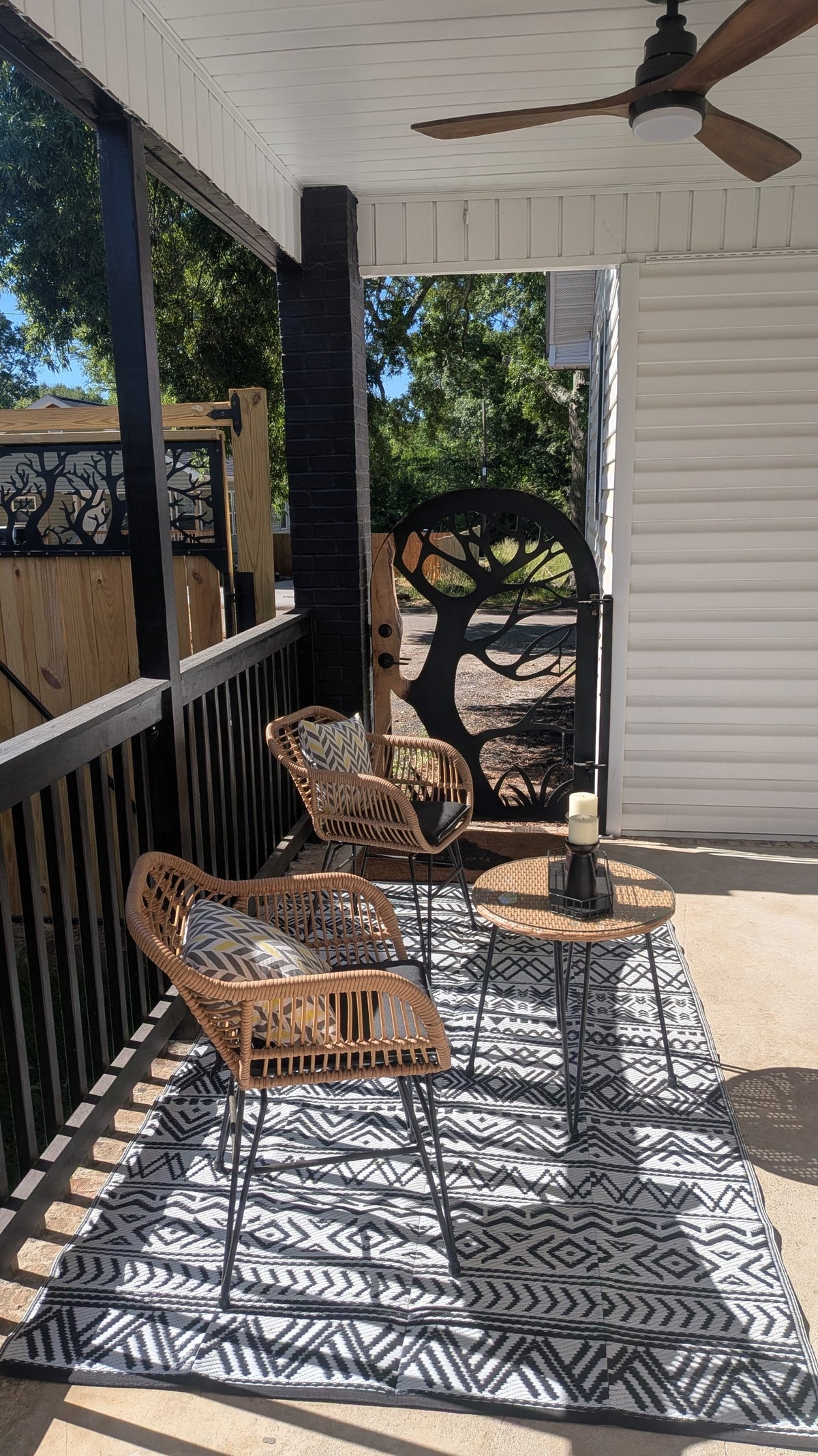 Custom steel porch gate with tree arch design by Expressive Door
