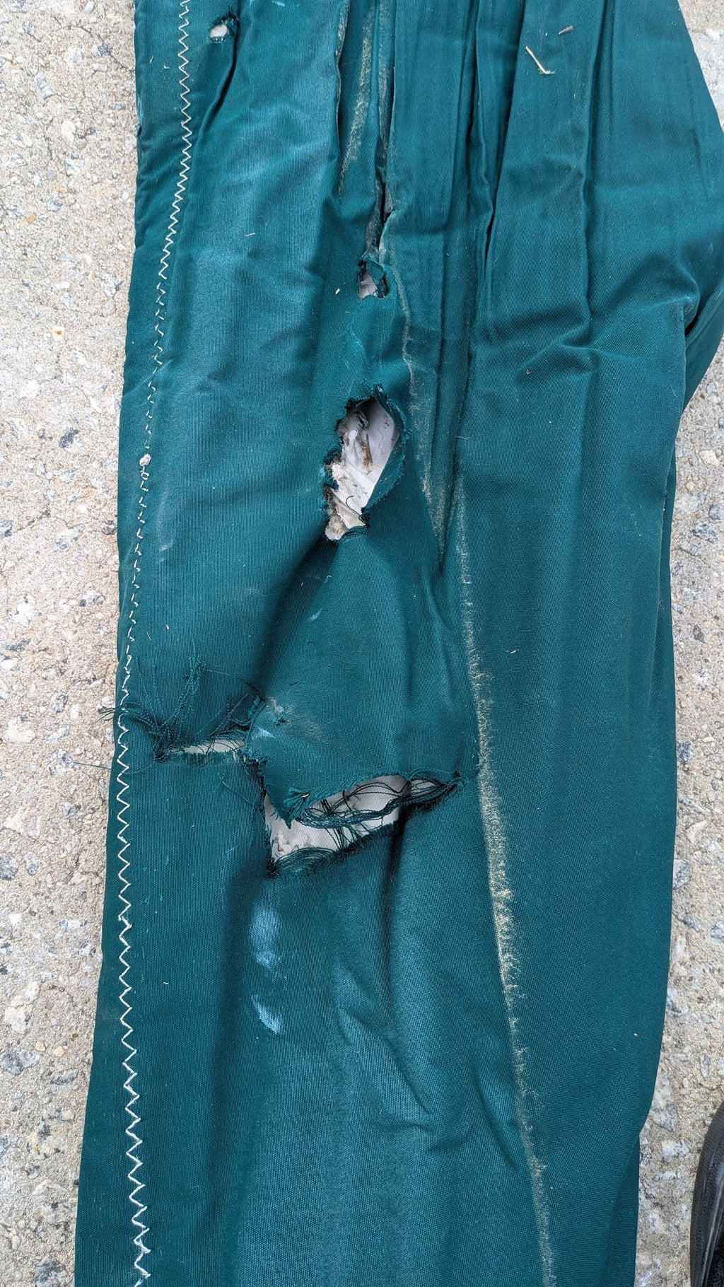 Tear in the sunbrella UV cover — see condition notes