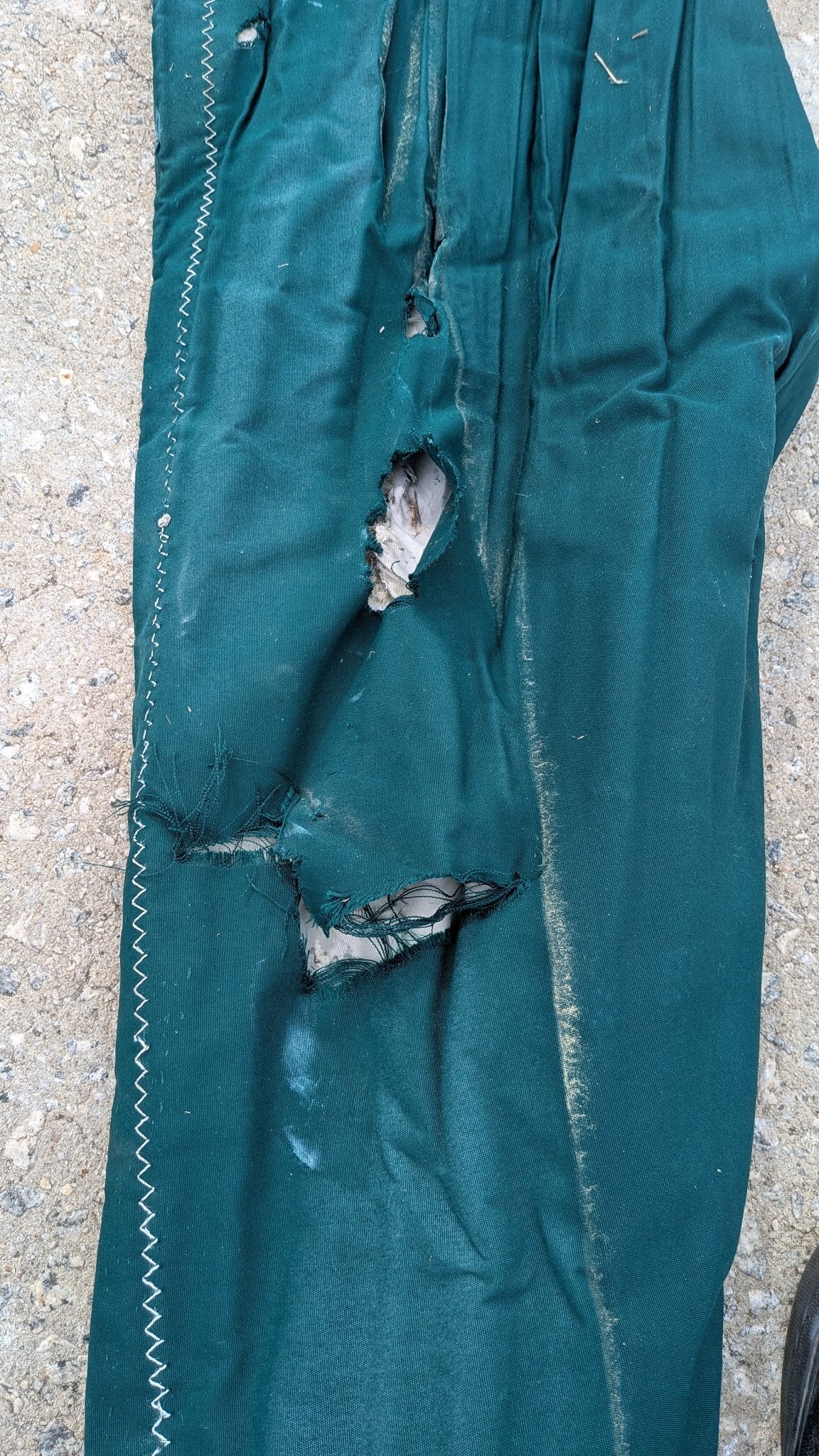 Tear in the sunbrella UV cover — see condition notes