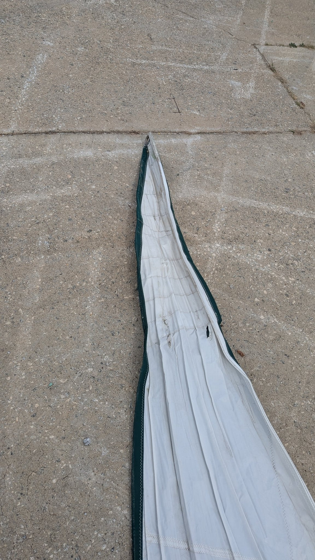 Sail folded showing the green leech and foot trim