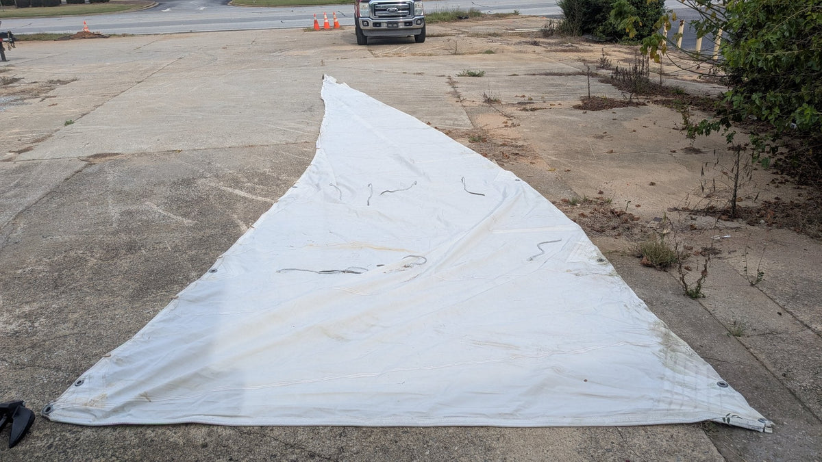 Used Dacron mainsail laid out