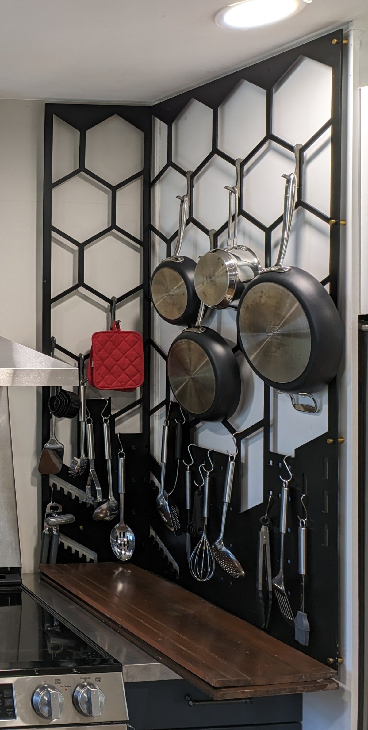 Wall mounted steel pot rack by Expressive Door