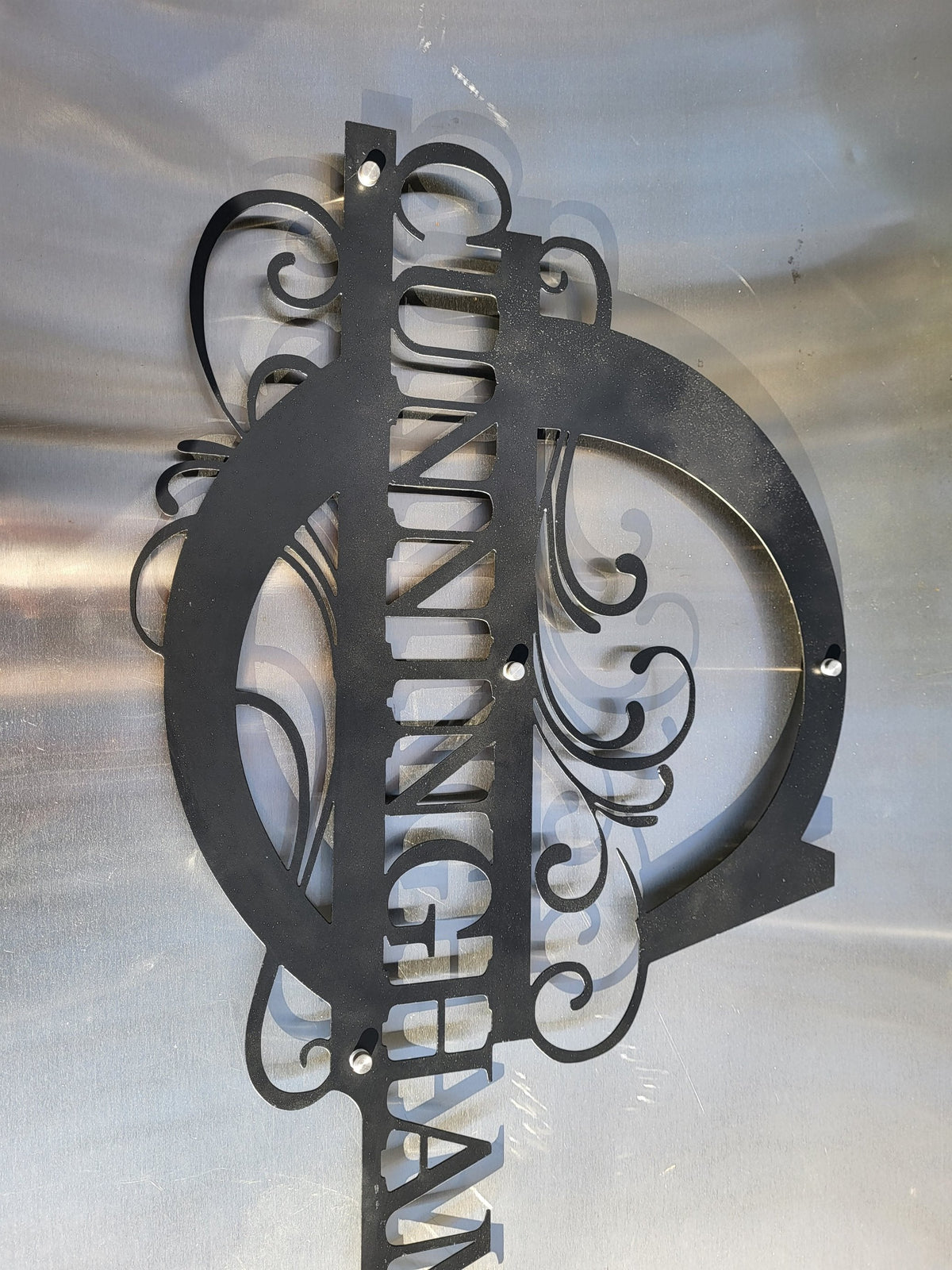 Custom metal monogram door sign by Expressive Door