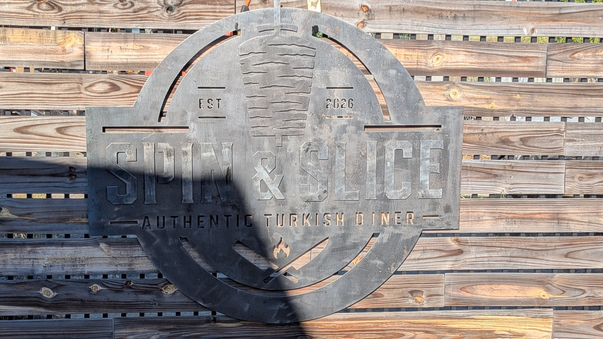 Custom plasma-cut metal business sign by Expressive Door