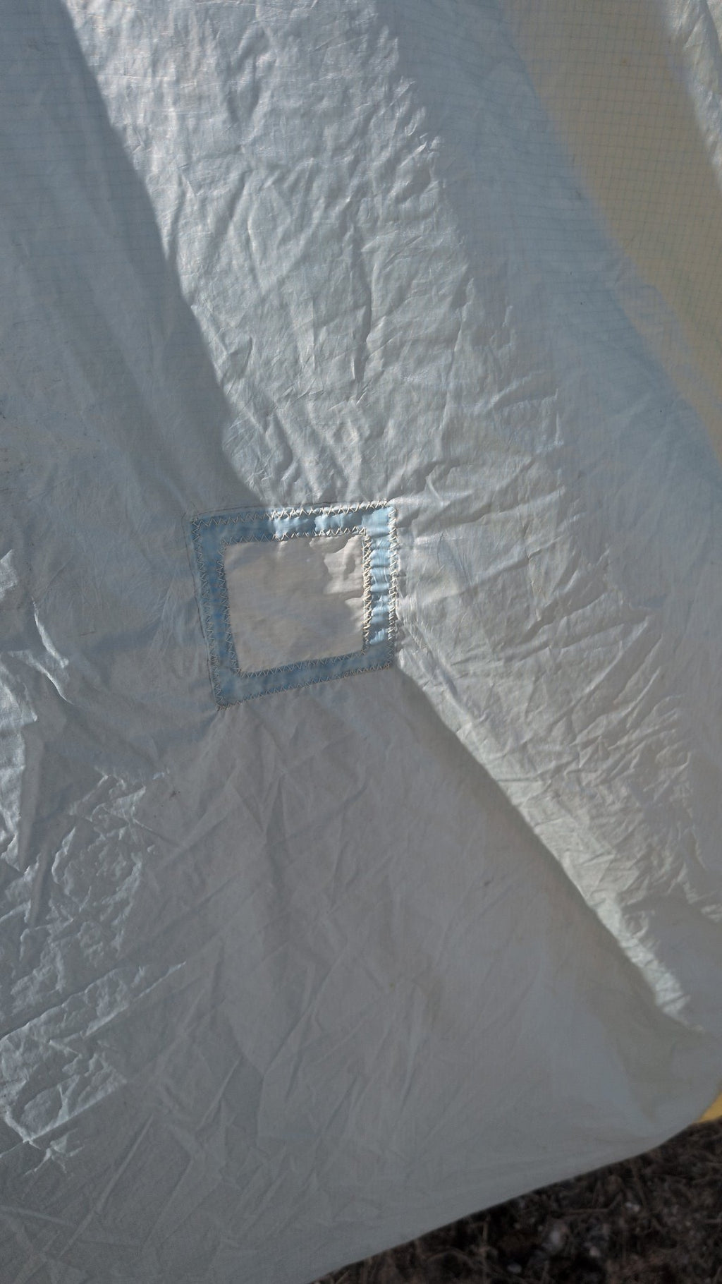Detail — small sewn patch on the spinnaker, second view